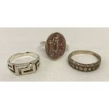 3 silver dress rings.