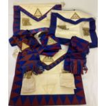 A quantity of vintage Masonic Royal Arch companions aprons and sash's.