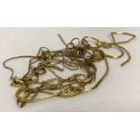 A bag of broken scrap gold chains and a bracelet. Marked or tests as 9ct gold.