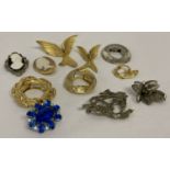 A small collection of vintage brooches and scarf clips.