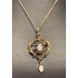 An Art Nouveau style 9ct gold lavaliere pendant set with sapphire and opals.