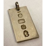 A vintage silver ingot pendant hallmarked London 1977, with hanging bale.