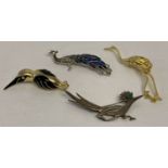 4 costume jewellery bird brooches. To include a peacock and a crane.