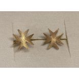 A pair of 18ct gold stud earrings in the shape of a Maltese cross. Hallmarks to posts.