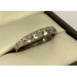 A vintage 9ct white gold eternity style ring set with small diamonds.