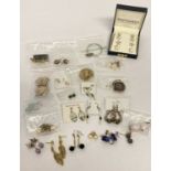26 pairs of modern and vintage costume jewellery earrings in drop and stud styles.