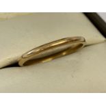 A 22ct gold thin wedding band. Fully hallmarked to inside of band.