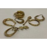 A small quantity of scrap gold hoop earrings.