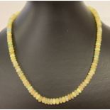 An 18 inch opal bead necklace with 9ct gold clasp. 100 cts of round cut opal beads.