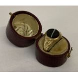 A Victorian 18ct gold plated ring set with black banded agate. In original ring box.