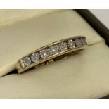 A 9ct gold and diamond illusion channel set eternity ring.