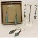 3 pairs of turquiose set earrings. A boxed pair of silver and turquoise drop earrings by So…Bo…
