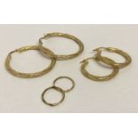 3 pairs of 9ct gold hoop style earrings.