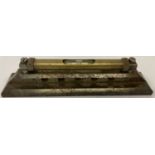 A vintage engineers 8" brass cased level attached to cast iron stand. One side stamped 271.
