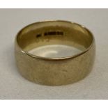 A vintage 9ct gold 8mm plain wedding band. Fully hallmarked to inside of band.