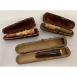 3 cased vintage cheroot holders. One with decorative white metal collar. One a/f.