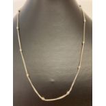 An Italian design double curb chain and bead silver necklace. Approx. 18 inches long.