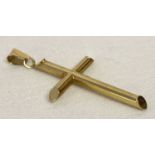 A 9ct gold cross pendant with bale. Hallmarked to bale.