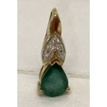 A 9ct gold Transvaal emerald and diamond set pendant.