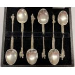A boxed set of 6 unusual German silver apostle style teaspoons with skeleton detail to handles.