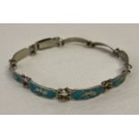 A vintage silver and enamel small panel bracelet decorated with Thai dancers. Push clasp.