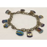A vintage silver double belcher chain charm bracelet with 10 enamelled silver town & county charms.
