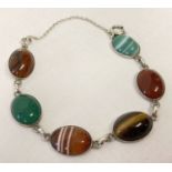 A Scottish silver and agate set bracelet by Iona, complete with safety chain.