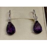 A pair of 18ct gold diamond and amethyst drop earrings by Luke Stockley, London.