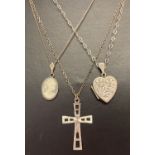 3 vintage silver necklaces. A floral engrave heart locket on a fine curb chain.