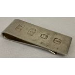 A silver money clip with large hallmark detail to front. Dated London 2010 with 925 and makers mark.