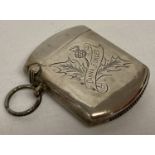 An antique silver vesta case with thistle design and "Dinna Forget" engraved to front.