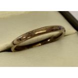 A 9ct gold wedding band. Hallmarks to inside of band.