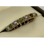 A 9ct gold full eternity ring set with small round cut green agate and pearls.