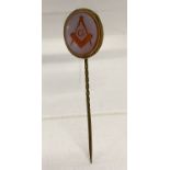 A Masonic Victorian Hardstone cameo style stick pin in gold mount.