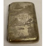 An antique Chinese silver cigarette case with engraved detail to both sides and dated 1899.