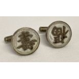 A pair of vintage silver and white stone cufflinks with Chinese symbols. Backs marked sterling H.K.