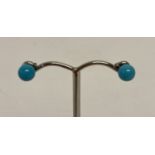 A pair of 9ct gold and turquoise ball style stud earrings complete with butterfly backs.