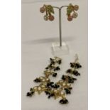 A pair of clip on earrings by Butler & Wilson in the shape of cherries.