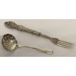 A Victorian silver pickle fork with scroll work to handle together with a silver sugar sifter spoon.