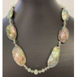 A 17" abalone shell, aventurine and white metal beaded necklace with S shaped hook fastening.