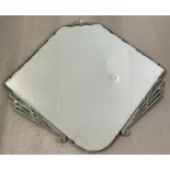 An Art Deco wall hanging mirror with green/blue pearlized panel detail.