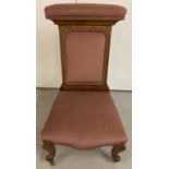 A Victorian Prie Dieu chair with turned cabriole style legs and ceramic castors.