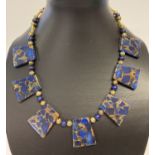 An unusual Lapis Lazuli and gold tone bead Cleopatra style necklace with S shaped hook clasp.