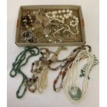 A box of natural stone, faux pearl and modern costume jewellery necklaces.