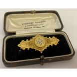 A Victorian 15ct gold and diamond brooch/pendant. With rear glass panel and inscription.