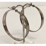 A large pair of modern design hoop earrings in silver tone by Emporio Armani.