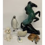 A collection of ceramic animal figurines.