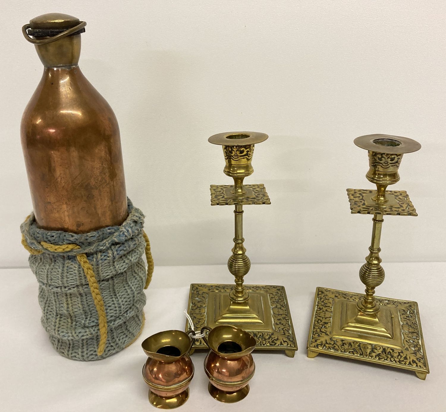 A collection of antique copper and brass items.