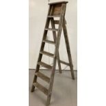 A vintage wooden step ladder.