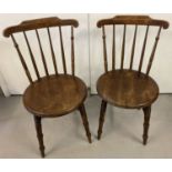 A pair of antique wooden Ibex "Penny" farmhouse kitchen chairs.